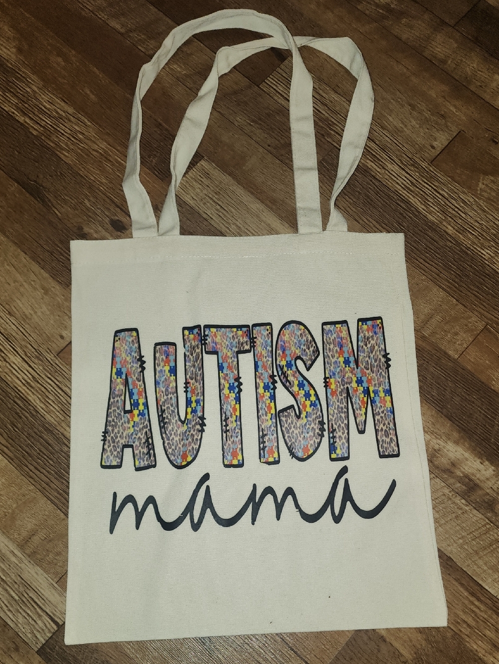 Autism Mama Canvas Tote Bag - Ivory with Multicolor Puzzle Lettering. 13x15.